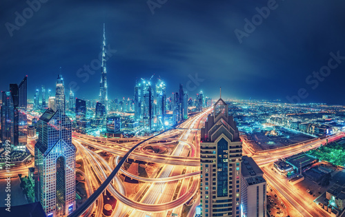 Spectacular skyline of a big modern city. Dubai, UAE. Aerial view on highways and skyscrapers.