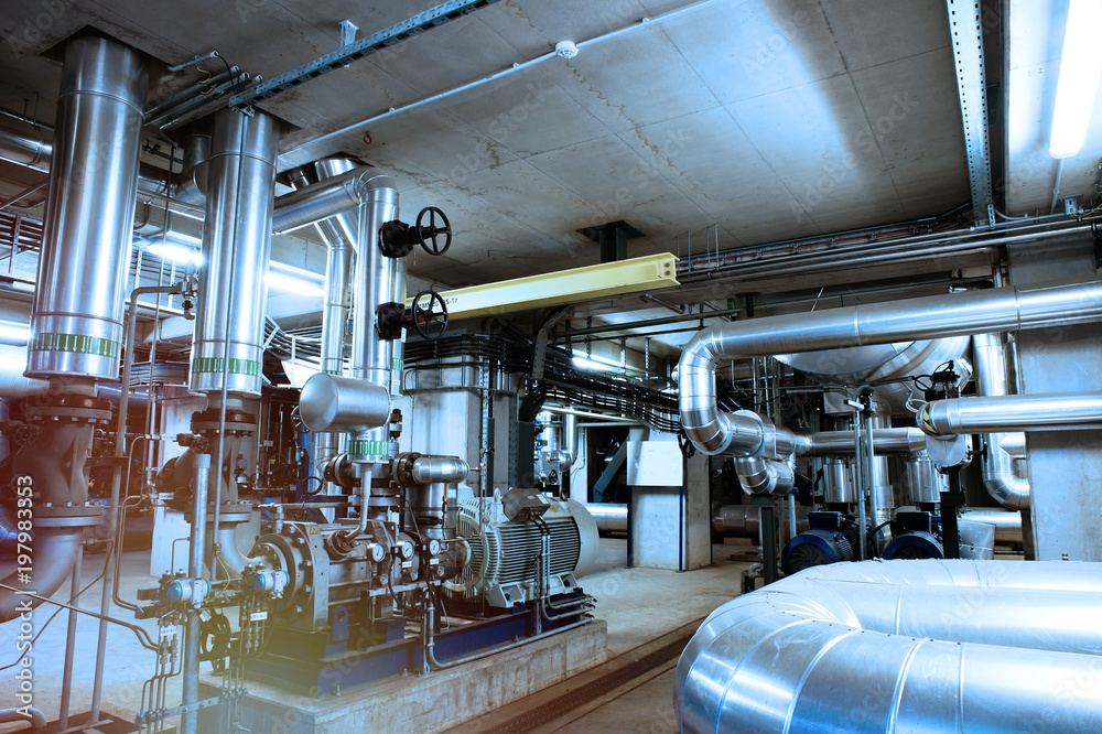 Equipment, cables and piping as found inside of a modern industrial power plant Equipment, cables and piping as found inside of a modern industrial power plant