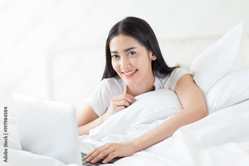 Attractive asian woman using laptop at home. People with lifestyle concept. Attractive asian woman using laptop at home. People with lifestyle concept.