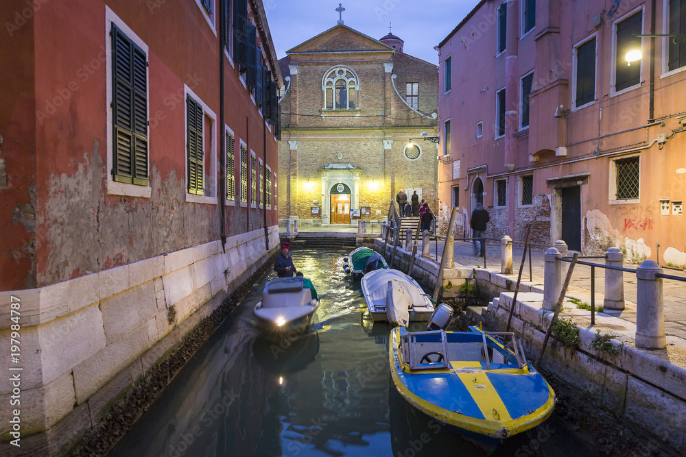 Picturesque Venetian canal at night with colorful buildings., Venice, Italy