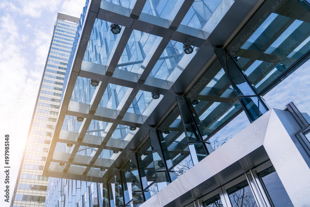 The entrance of the modern Enterprise Building, in the face view of the blue ton The entrance of the modern Enterprise Building, in the face view of the blue ton
