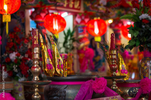 Red candles and burning incense sticks Paper gold for pay respect to god in Chinese New Year day at a Chinese shrine.