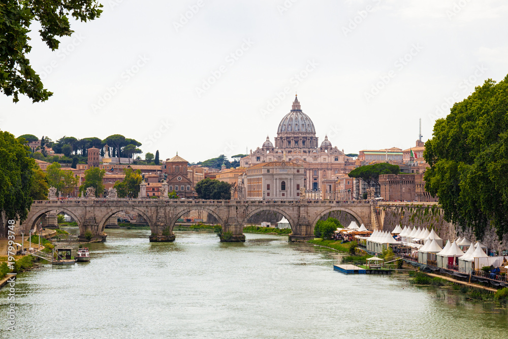 view of old Sant' Angelo Bridge  and St. Peter's cathedral in Vatican City Rome Italy.