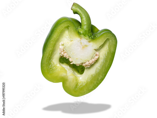 a part of fresh green bell pepper slide isolated on white background with shadow