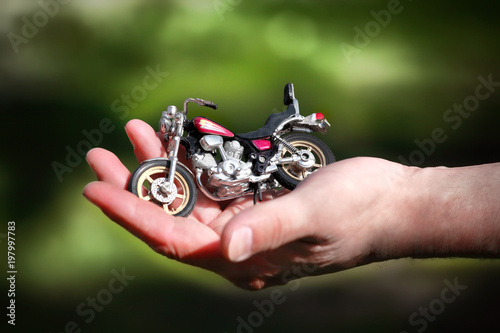 Motorcycle on the palm of your hand photo