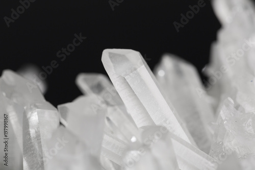 Pure Quartz Crystal cluster on black background photo