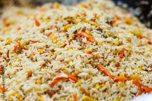 rice pilaf with meat carrot and onion background photo