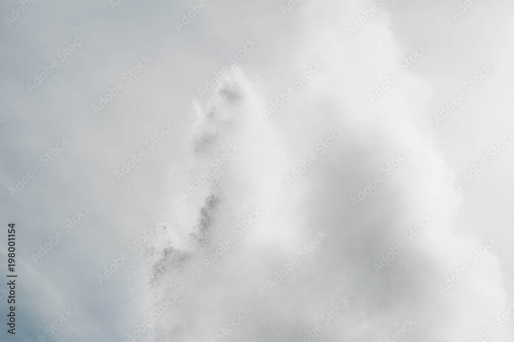 water from powerful geyser and cloudy sky, Geysir, iceland