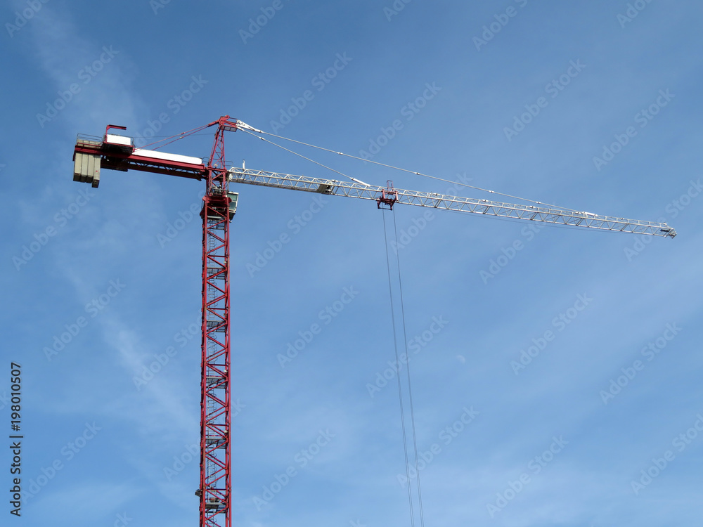 Construction crane on the background of blue sky Construction crane on the background of blue sky