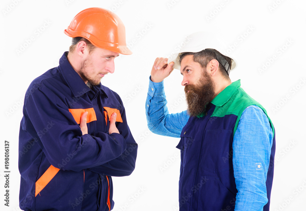 Builder, architect, engineer with serious face. Conflict at site concept Builder, architect, engineer with serious face. Conflict at site concept