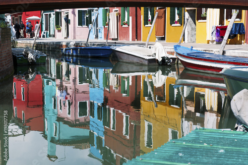 Burano, Venice, Italy- houses reflection in the canal © tanialerro