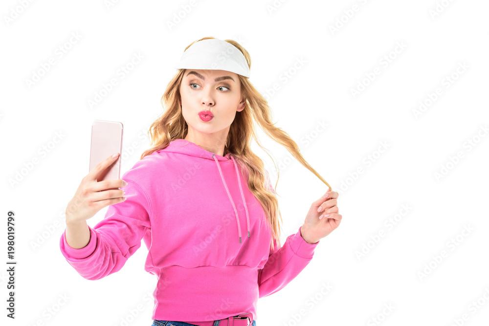 Attractive young woman dressed in pink taking selfie isolated on white Attractive young woman dressed in pink taking selfie isolated on white