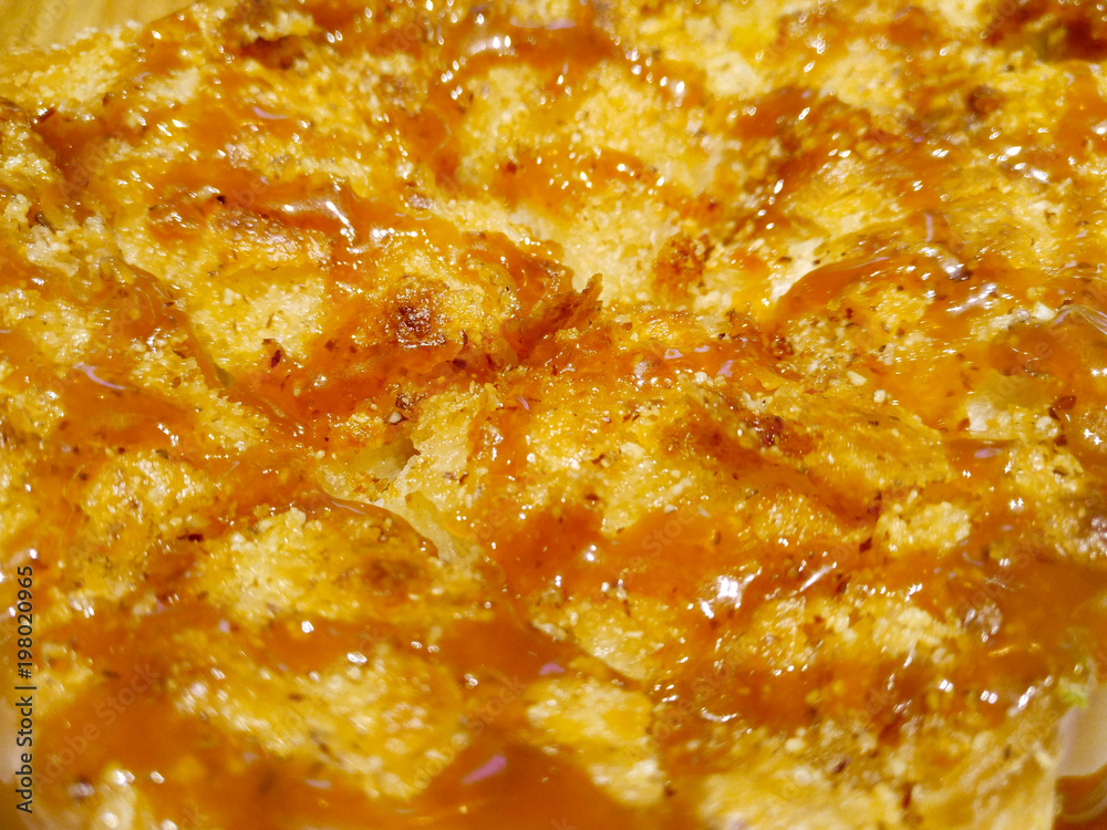 crunchy almond mixed bread toast, topped with toffee brown caramel flowing down like lava crunchy almond mixed bread toast, topped with toffee brown caramel flowing down like lava
