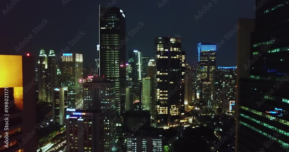 JAKARTA - Indonesia. March 19, 2018: Beautiful aerial view of night lights and skyscrapers in Jakarta central business district. Shot in 4k resolution JAKARTA - Indonesia. March 19, 2018: Beautiful aerial view of night lights and skyscrapers in Jakarta central business district. Shot in 4k resolution