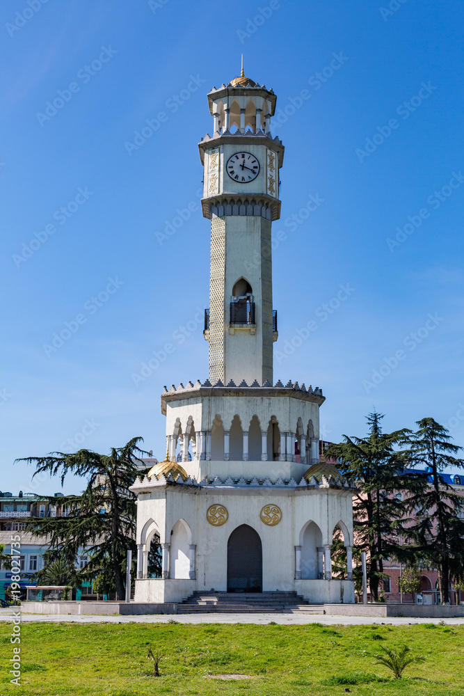 BATUMI, GEORGIA - MARCH 17, 2018: A tower in the style of the Ottoman Empire with a clock and a yellow dome. Also known as the Tower of Chacha
