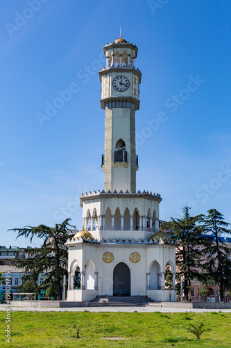 BATUMI, GEORGIA - MARCH 17, 2018: A tower in the style of the Ottoman Empire with a clock and a yellow dome. Also known as the Tower of Chacha 