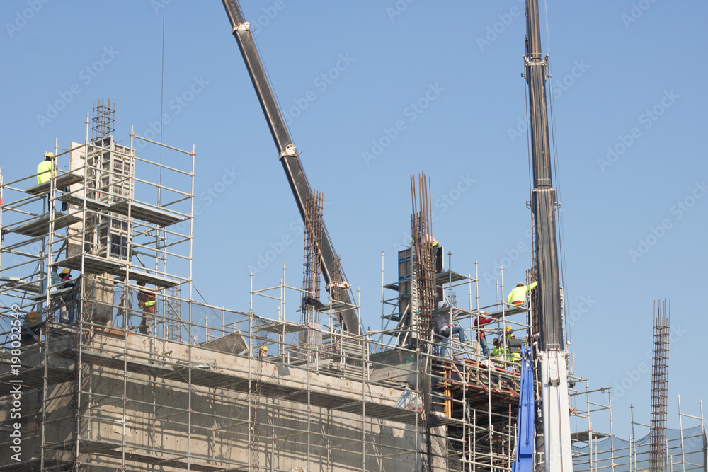 building worker and crane
