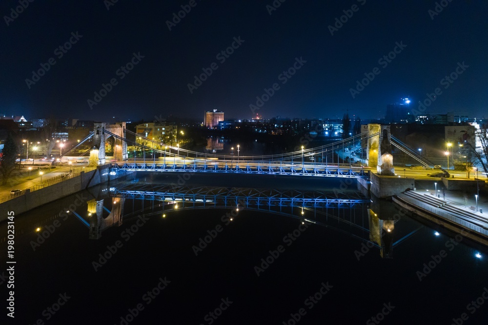 Aerial night drone view on Grunwald Bridge over Odre river in Wroclaw