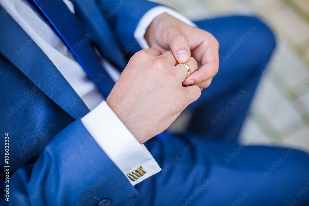 Wedding ring on the groom finger