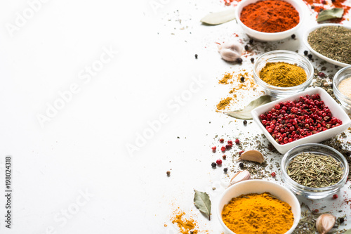 Fototapeta Naklejka Na Ścianę i Meble -  Spices in a bowls on white.