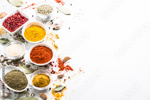 Fototapeta Naklejka Na Ścianę i Meble -  Spices in a bowls on white.