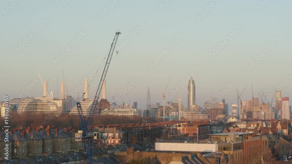 Epic crane shot over Battersea, then establishing iconic London cityscape on a warm day Epic crane shot over Battersea, then establishing iconic London cityscape on a warm day
