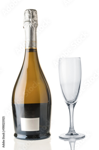 Champagne bottle and empty goblet isolated on white background