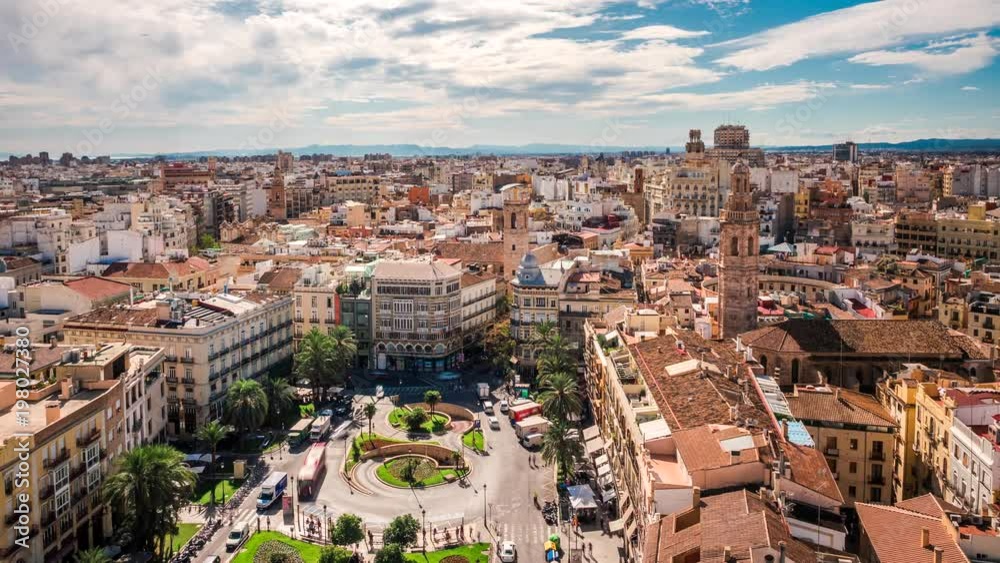 Valencia, Spain, time lapse view of traffic and people at Plaza de la Reina during daytime.
