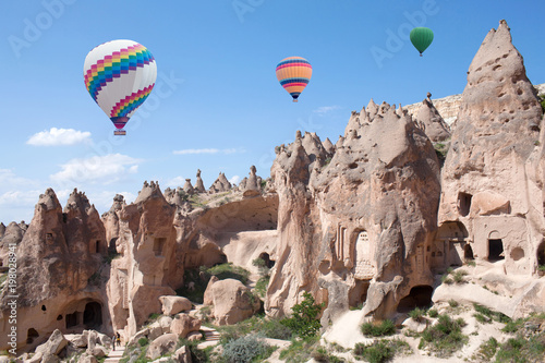 Colorful hot air balloons flying over Zelve valley, Cappadocia, Central Anatolia, Turkey