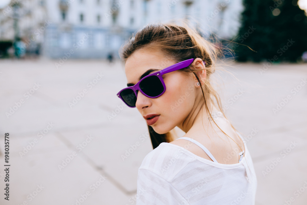 Beautiful woman posing on urban street