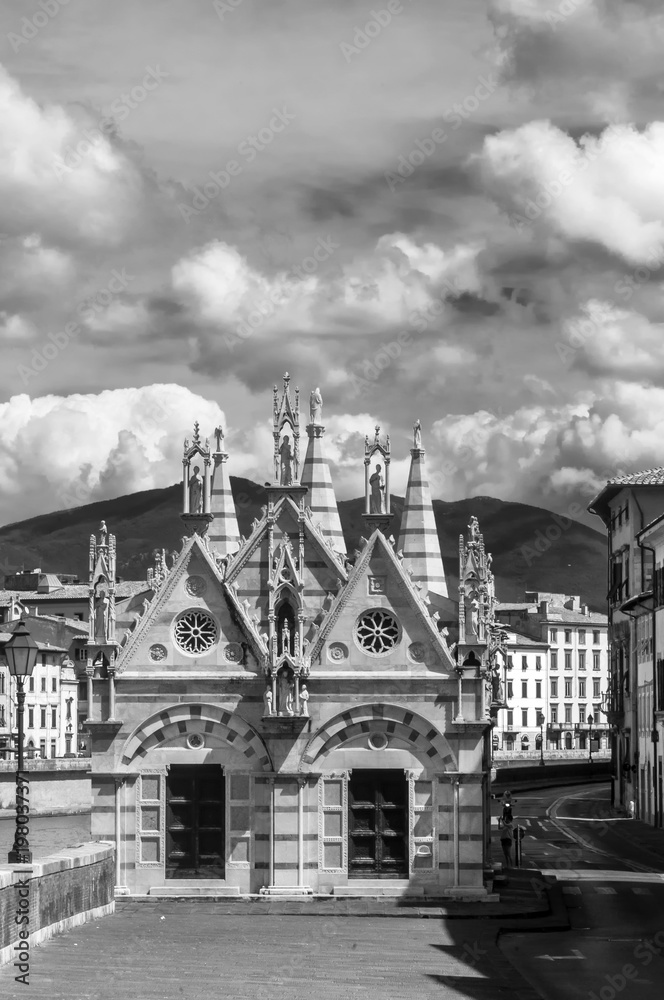 Black and white view of Santa Maria della Spina, beautiful Church on the banks of the Arno river in Pisa, Tuscany, Italy