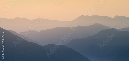 Landscape silhouette of the mountains at sunset. Panorama of peaks mountain in the Greece © flowertiare