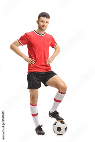 Soccer player posing with a football © Ljupco Smokovski