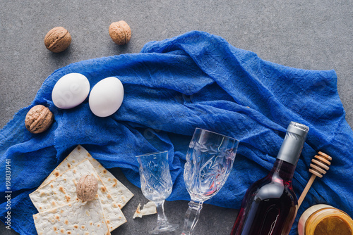 top view of matza, honey and wine on table, Passover Tale concept