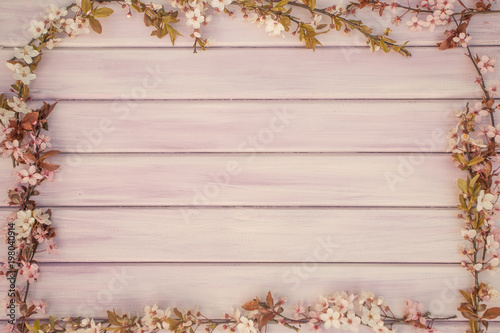 Spring pink/purple wooden background with blossom