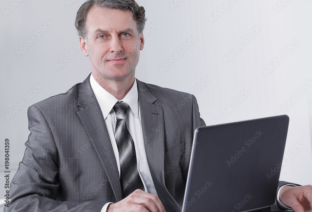 businessman is working with laptop in office businessman is working with laptop in office