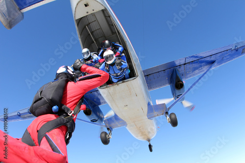 Fototapeta Naklejka Na Ścianę i Meble -  Formation skydiving. Skydivers have just jumped out of a plane.
