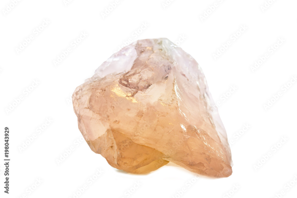 Macro shooting of natural gemstone. Raw mineral rose quartz. Isolated object on a white background.