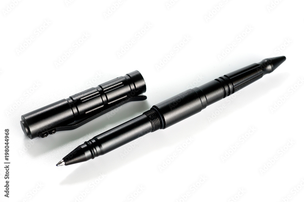 Aluminum self-defense tactical ink pen in black on a white background Aluminum self-defense tactical ink pen in black on a white background