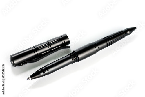 Aluminum self-defense tactical ink pen in black on a white background