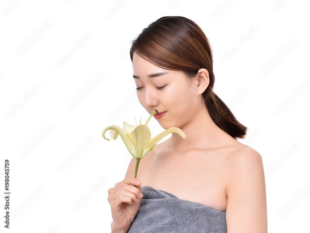 Beautiful woman holding a lily
