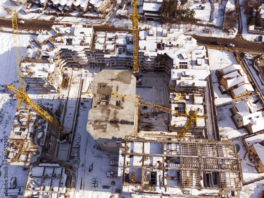 construction of a residential complex, air filming, toned, background image on a winter day