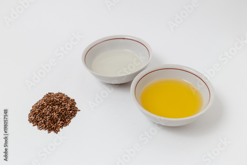 flax and sunflower oil on white background