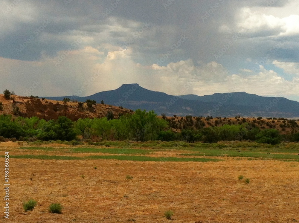 Northern New Mexico with rain clouds and virga