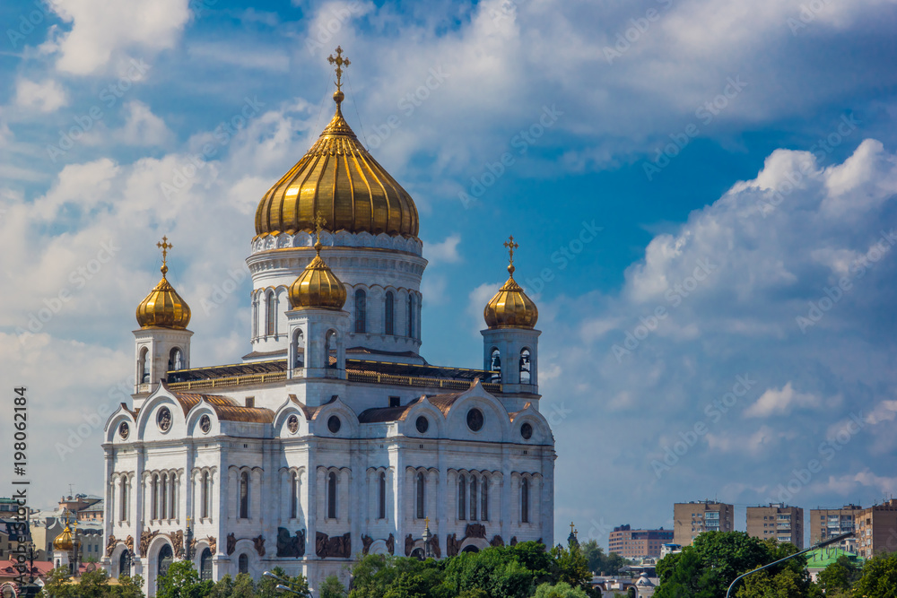 Christ the Savior Cathedral in Moscow on a background of beautiful blue sky with clouds