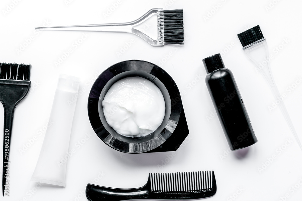 Tools for hair dye in barbershop on white background top view