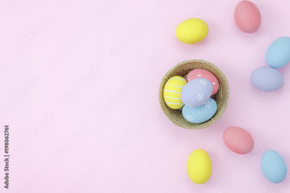 Table top view shot of arrangement decoration Happy Easter holiday background concept.Flat lay colorful bunny egg in wood basket on modern pink paper at home office desk.Space for creative design. Table top view shot of arrangement decoration Happy Easter holiday background concept.Flat lay colorful bunny egg in wood basket on modern pink paper at home office desk.Space for creative design.