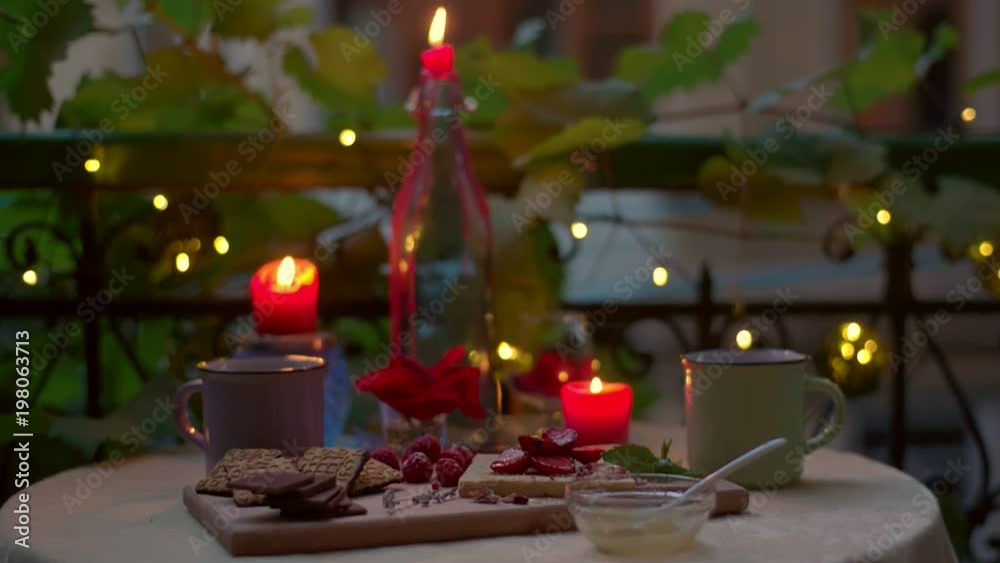 Still shot of a romantic dinner table with sweet meals and tea Still shot of a romantic dinner table with sweet meals and tea