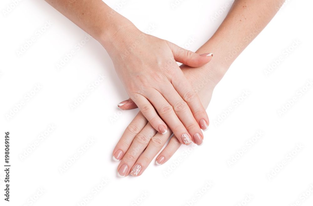 Female hands with beautiful manicure on a white background. Closeup Female hands with beautiful manicure on a white background. Closeup