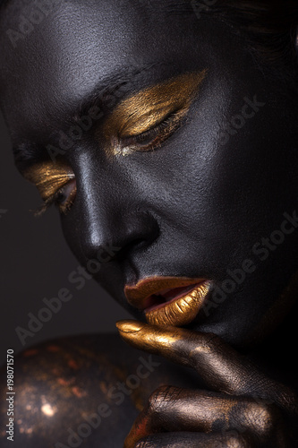 Portrait of a beautiful young girl and creative make-up.